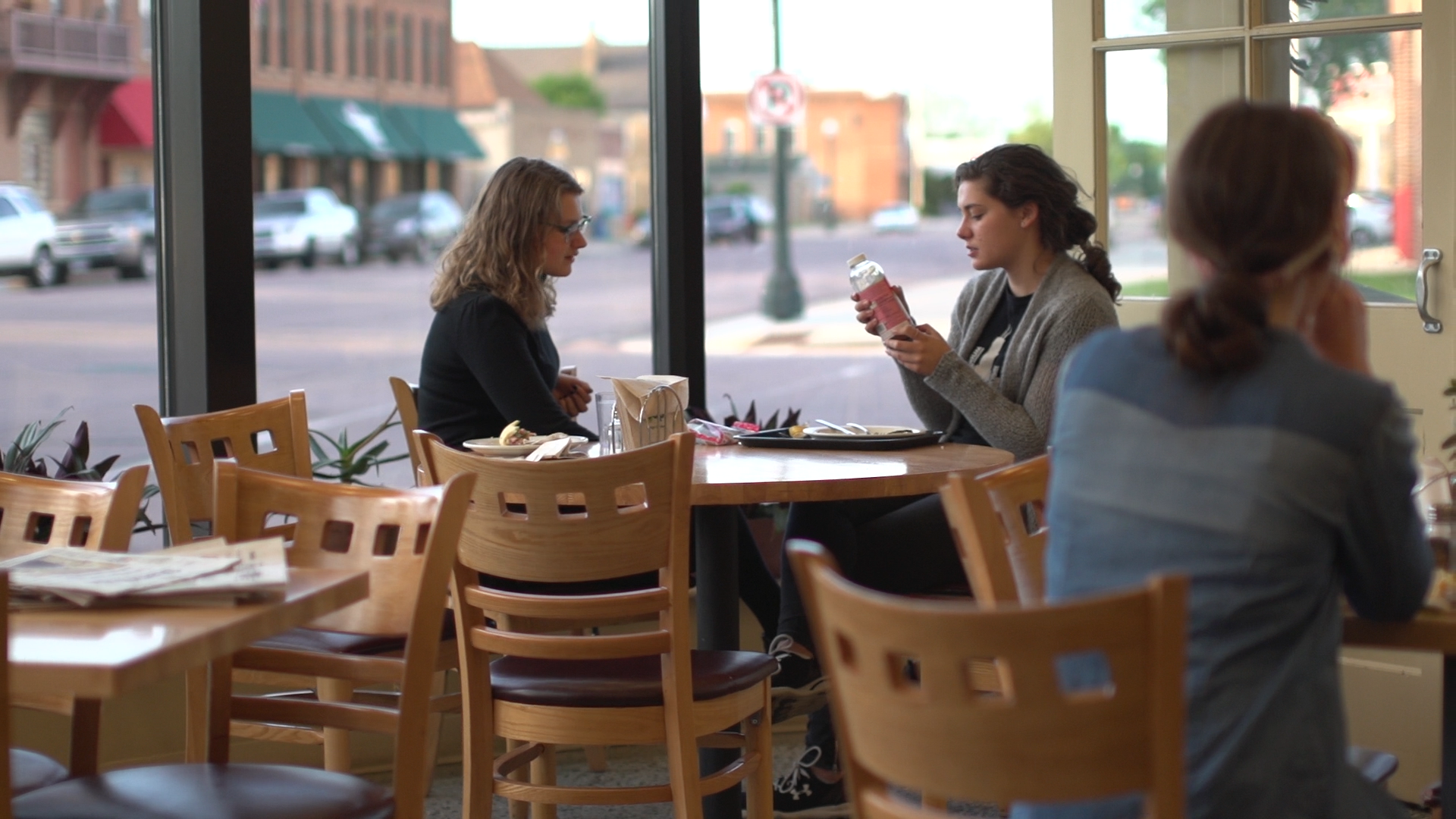 photo of women sitting in Co-op deli