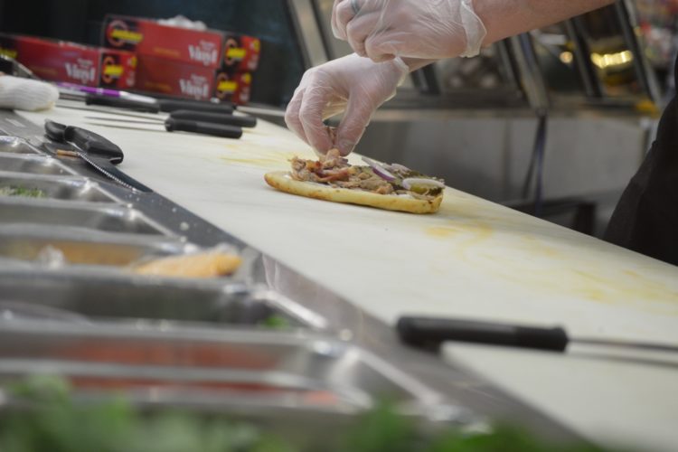 a photo of a sandwich being made in the St. Peter Food Co-op Deli