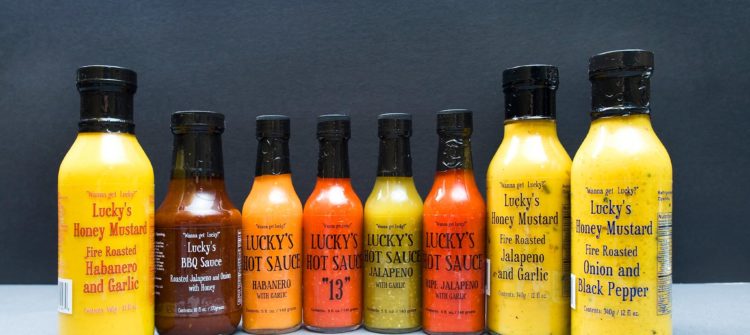a photo of hot sauces from Lucky's Popcorn Dressing