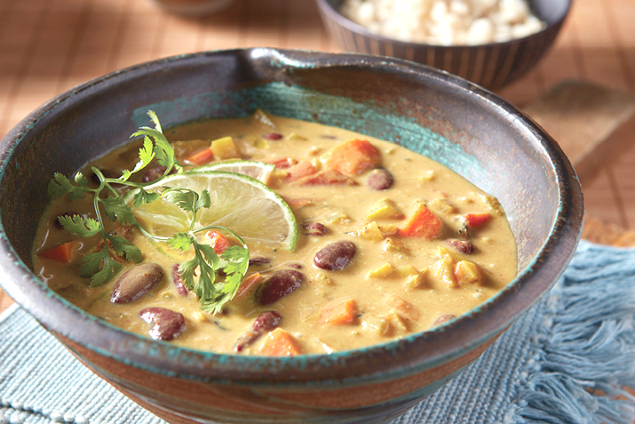 Vegetables and convenient canned beans simmer in a creamy soup, laced with warming curry spices.