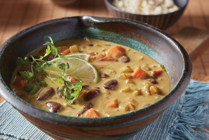 Vegetables and convenient canned beans simmer in a creamy soup, laced with warming curry spices.
