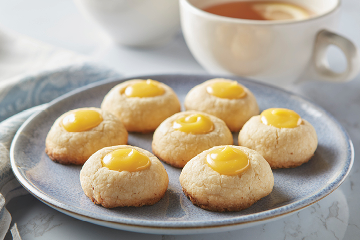 Tender, buttery cookies get an upgrade with the addition of lemon curd nestled into the center of each cookie like a spot of sunshine.