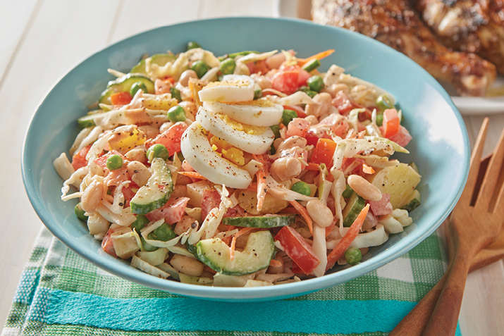 With boiled eggs, potatoes and mayo, this veggie salad shares some ingredients with American potato salad, but that’s where the similarities end.