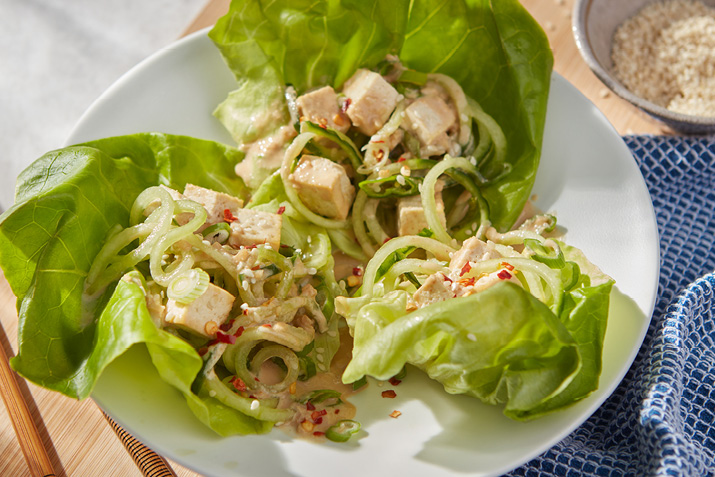 Cool off with a bowl of curly cucumber “noodles,” coated in a tangy, savory tahini dressing.