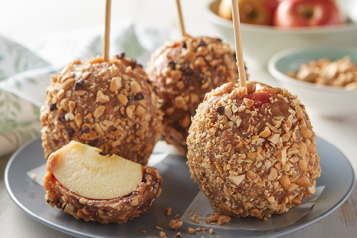 These DIY candy apples are fun to make and couldn't be simpler. Enlist the help of little ones when rolling the apples in chocolate or nuts.
